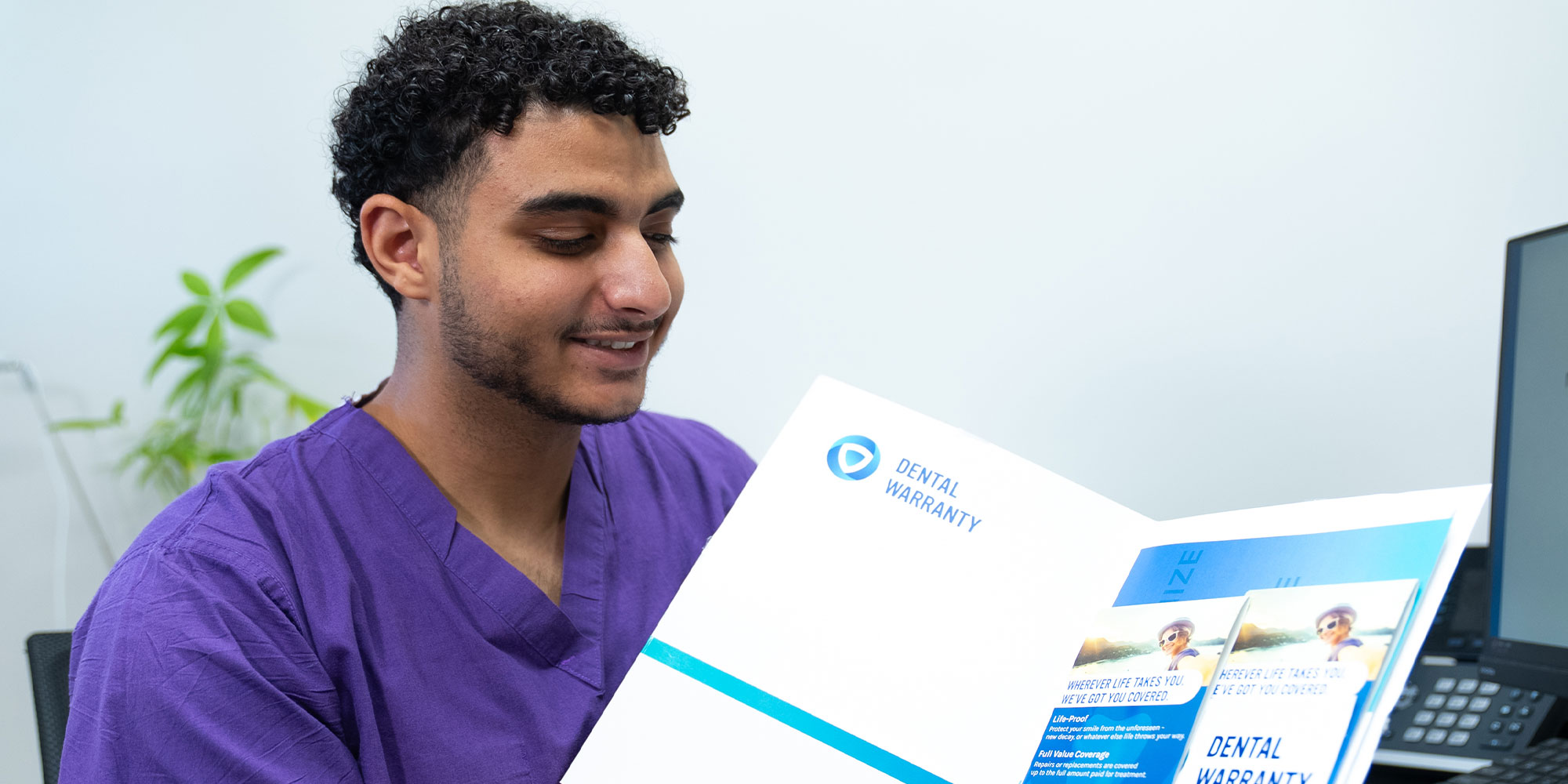 team member going over insurance forms with Patient