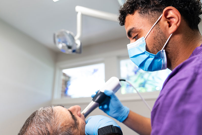 Doctor taking a 3d scan of Patients mouth