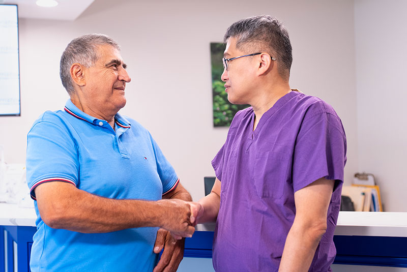 Patient shaking doctors hand