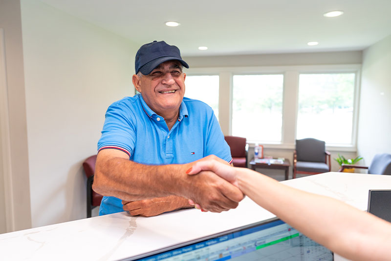 Patient Shaking hands with team member