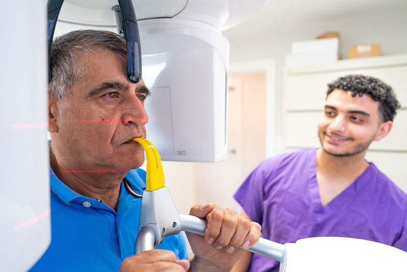Patient taking a dental x-ray of their teeth