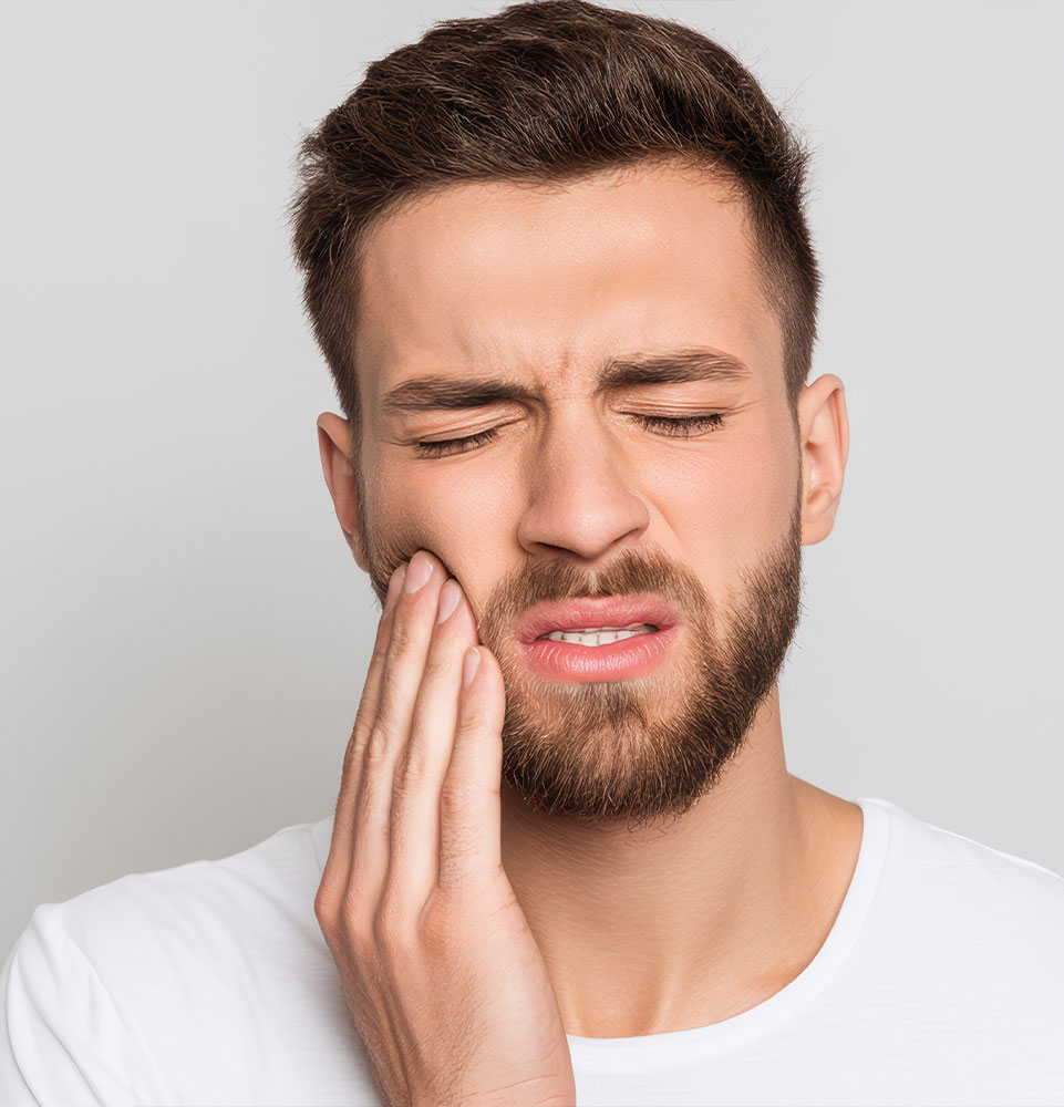 Man holding face in pain