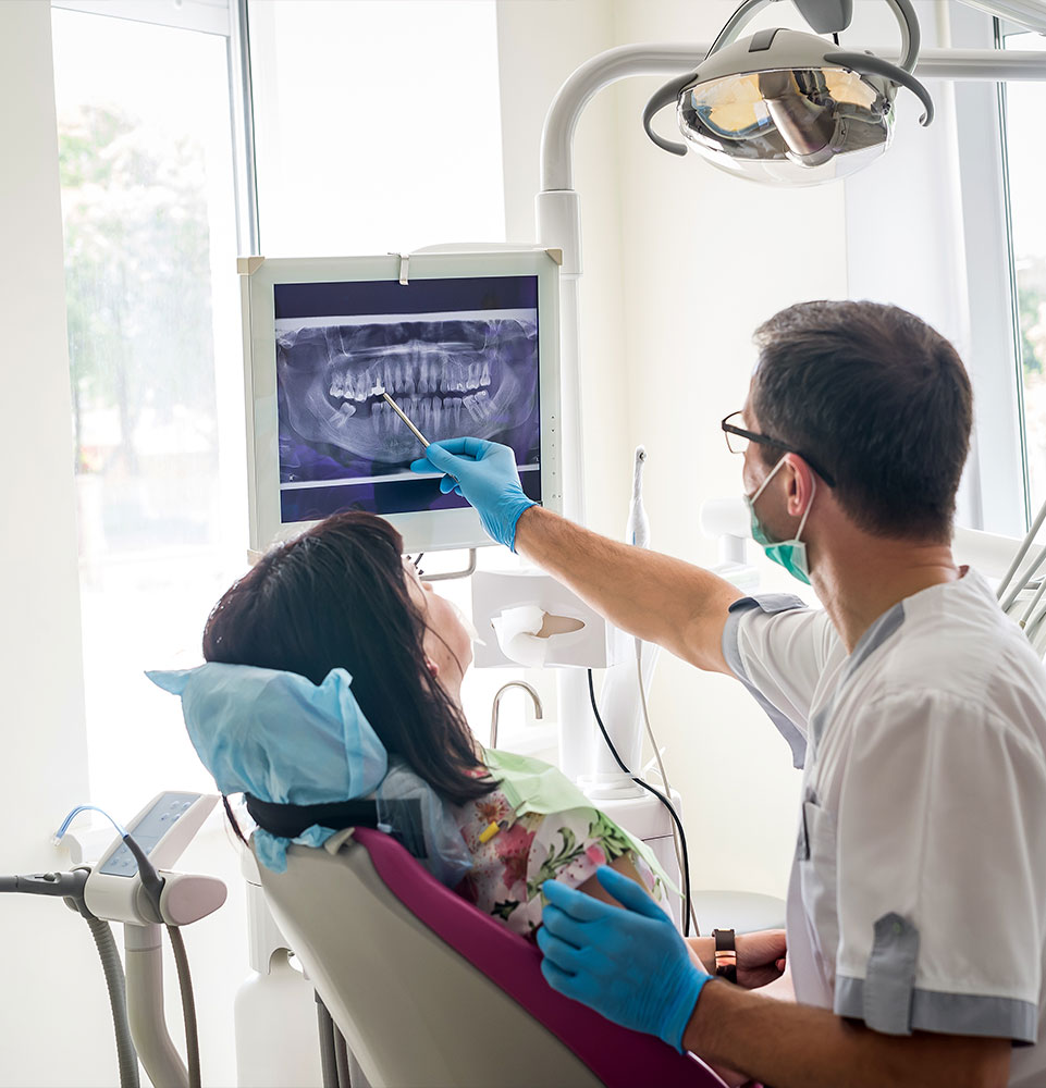 Doctor Going over dental x-ray with Patient
