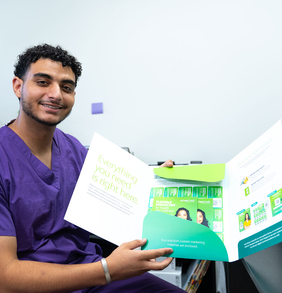 team member holding finance papers