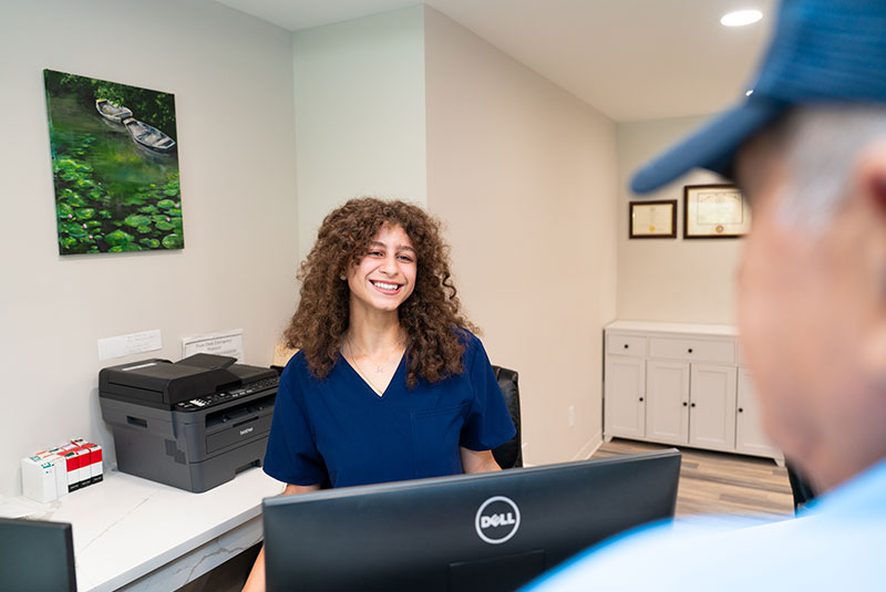 team member checking into dental office