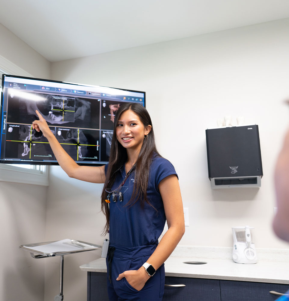 Doctor consulting with Paitent Over a dental x-ray
