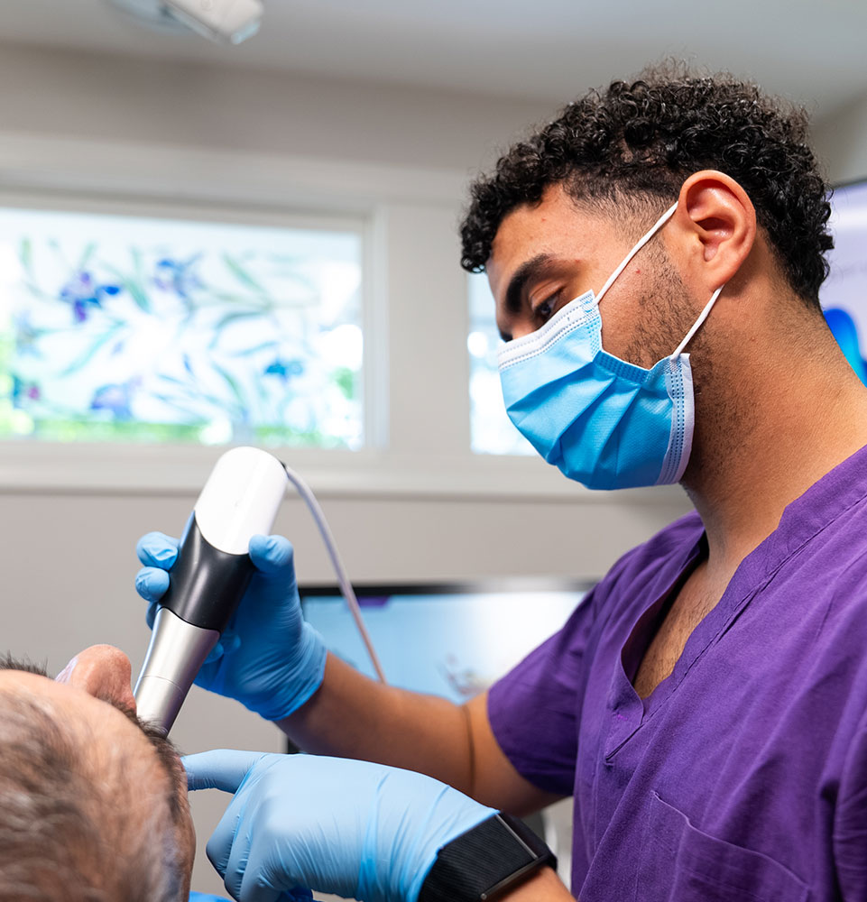 team member taking 3d scan Patients mouth