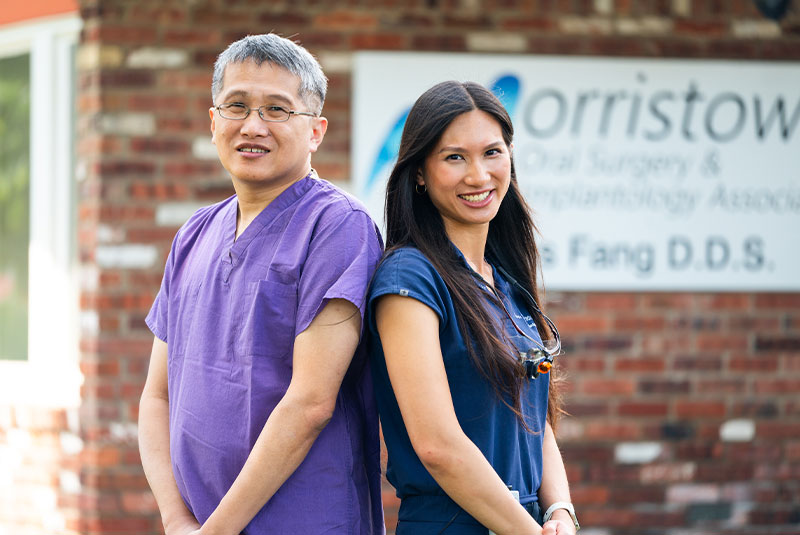 Doctors standing back to back