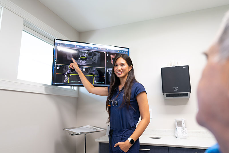 Doctor Pointing at dental x-ray
